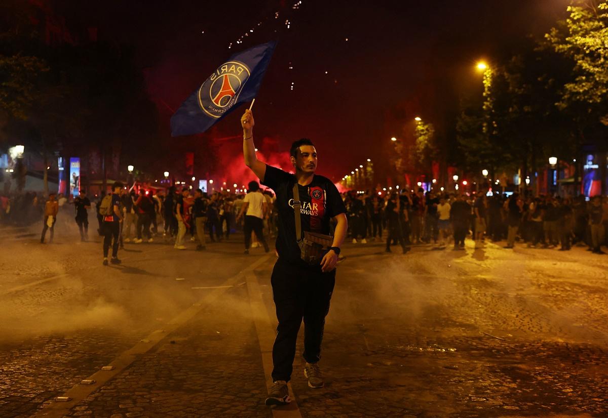 Party time for Paris St Germain fans on the Champs Elysees avenue, near the Arc de Triomphe.