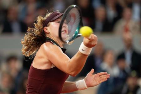 Mirra Andreeva returns a shot during her match against Lois Boisson