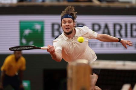 Alexander Bublik of Kazakhstan returns a shot during his match against Jannik Sinner of Italy