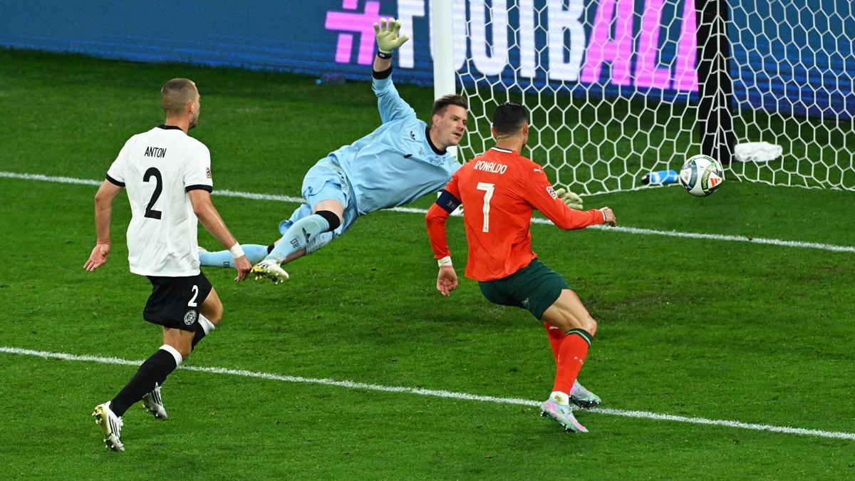 Cristiano Ronaldo celebrates scoring Portugal's second goal with Nuno Mendes during the  Nations League semi-final against Germany at Allianz Arena, Munich, on Wednesday.