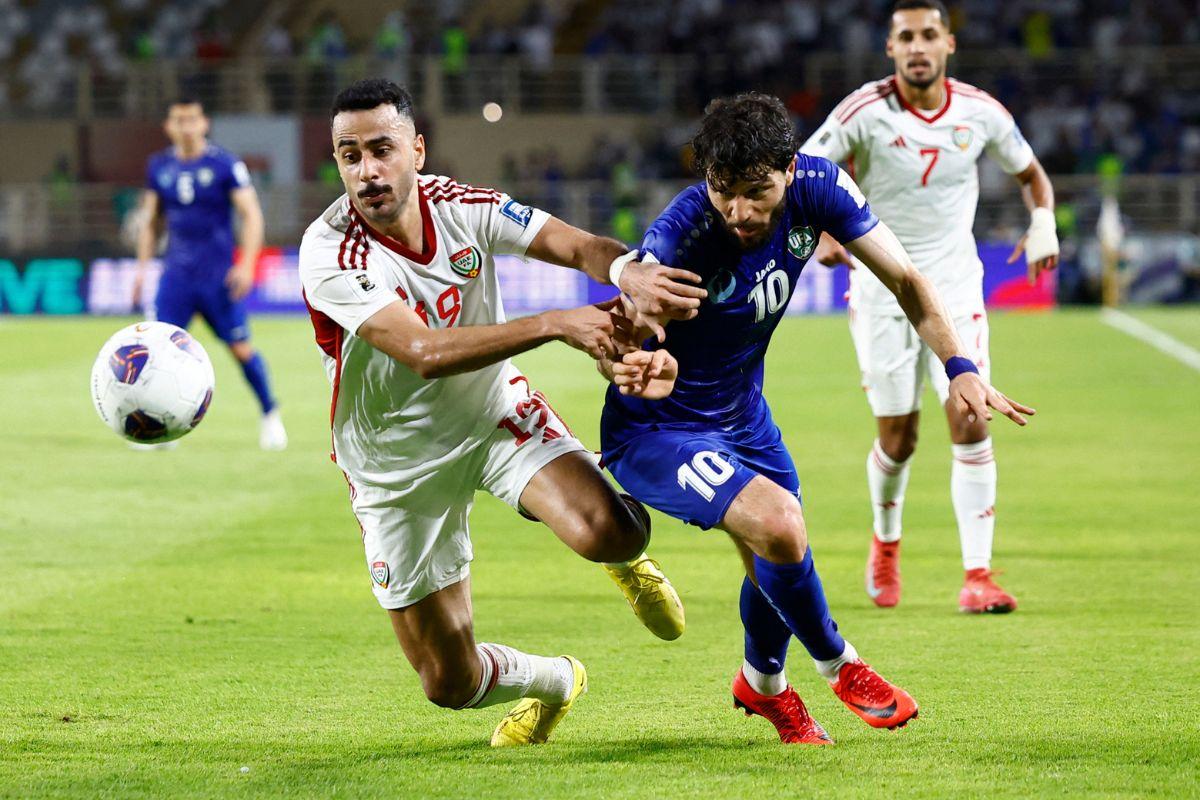 United Arab Emirates' Khaled Ebraheim vies for the ball with Uzbekistan's Jaloliddin Masharipov during their AFC Qualifiers Group A match at Al Nahyan Stadium, Abu Dhabi, United Arab Emirates 