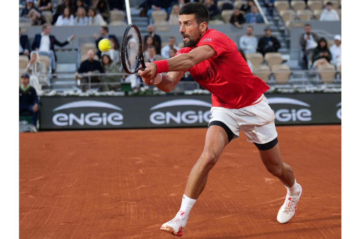 Novak Djokovic returns a shot during his match against Jannik Sinner