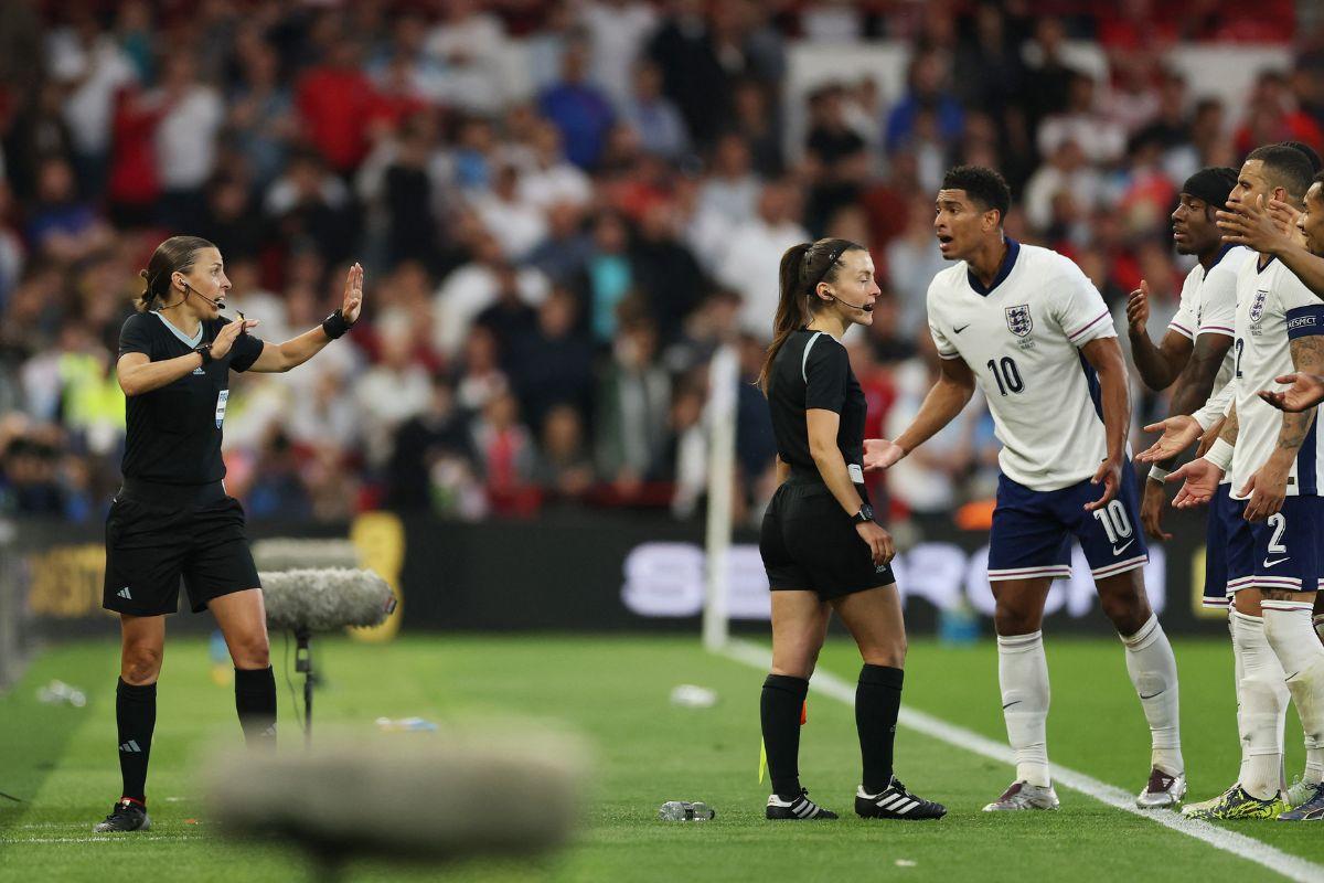 England's Jude Bellingham remonstrates with referee Stephanie Frappart during a VAR review after scoring their second goal which was later disallowed 