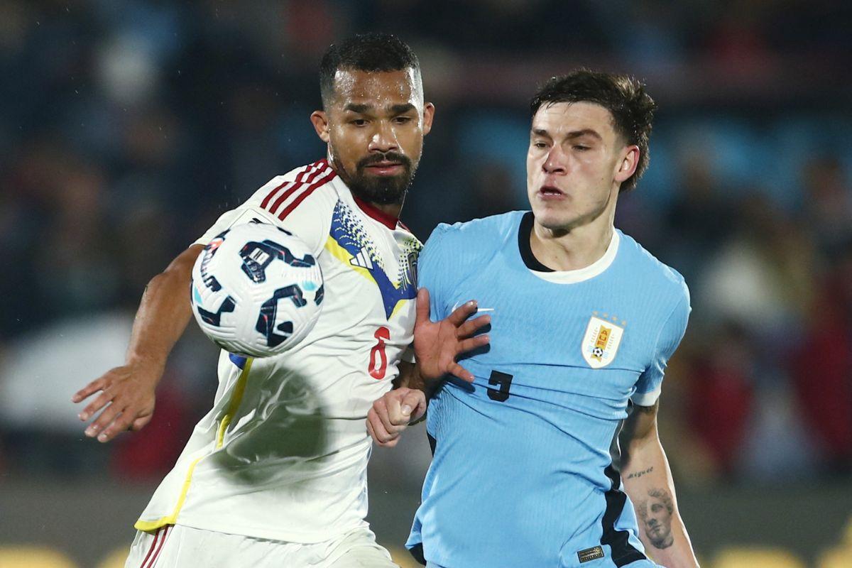 Uruguay's Manuel Ugarte in action with Venezuela's Yangel Herrera in action during ther match at Estadio Centenario, Montevideo, Uruguay 