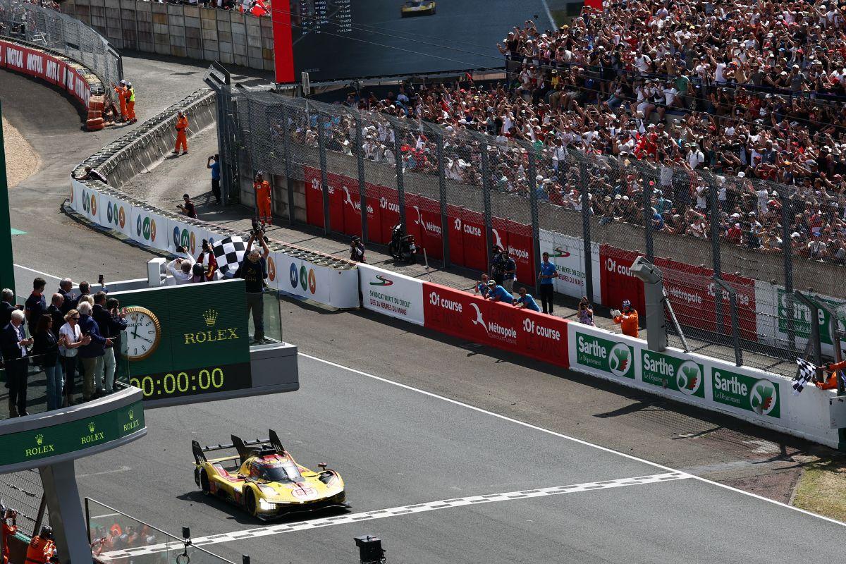 AF Corse's Robert Kubica, Yifei Ye and Philip Hanson cross the line to win the 24 Hours of Le Mans at Circuit de la Sarthe, Le Mans, France, on Sunday