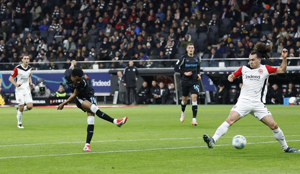 Nathan Tella scores Bayern Leverkusen's first goal in the Bundesliga match against Eintracht Frankfurt at Deutsche Bank Park, Frankfurt.