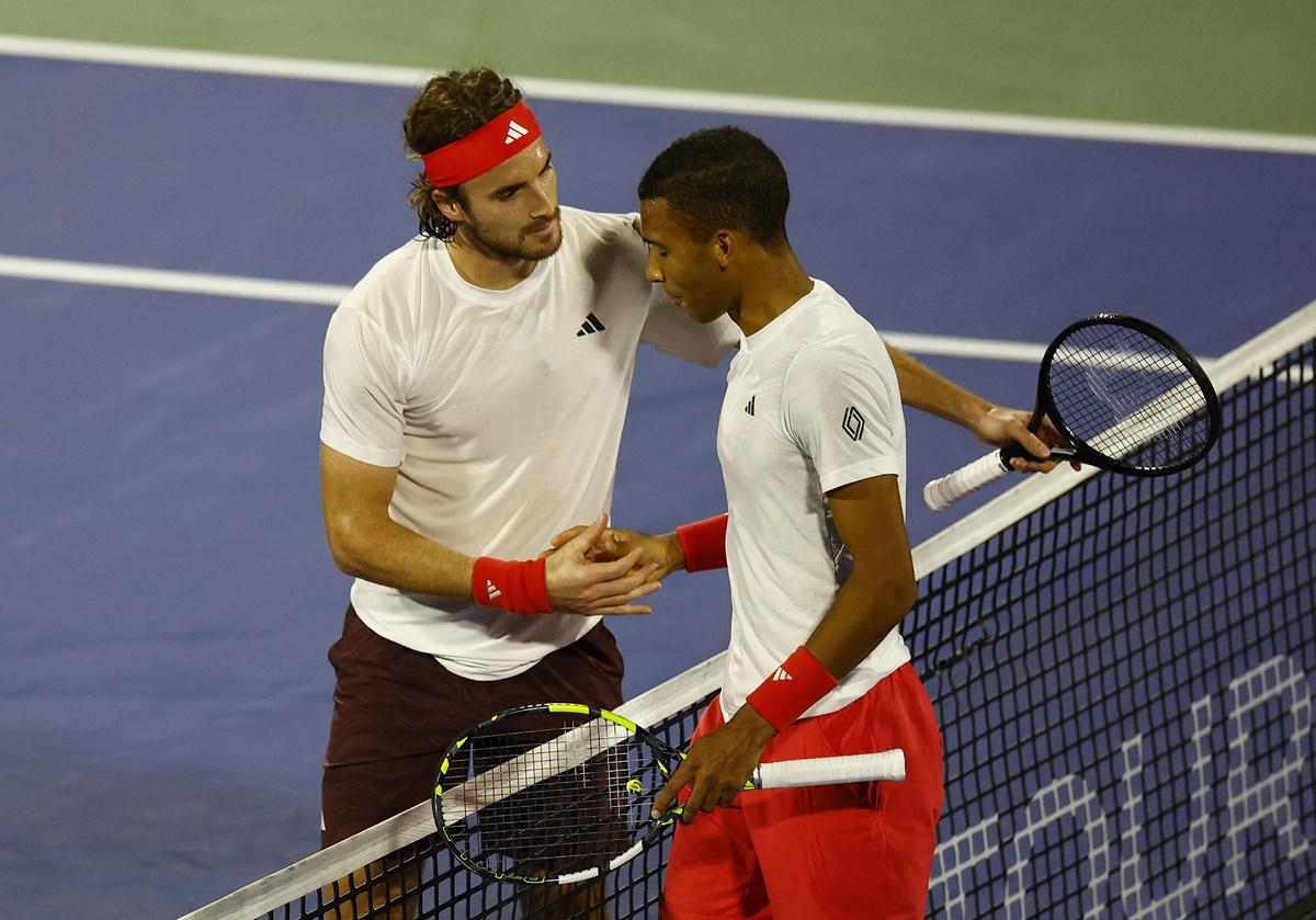 Stefanos Tsitsipas and Felix Auger Aliassime shake hands after final.