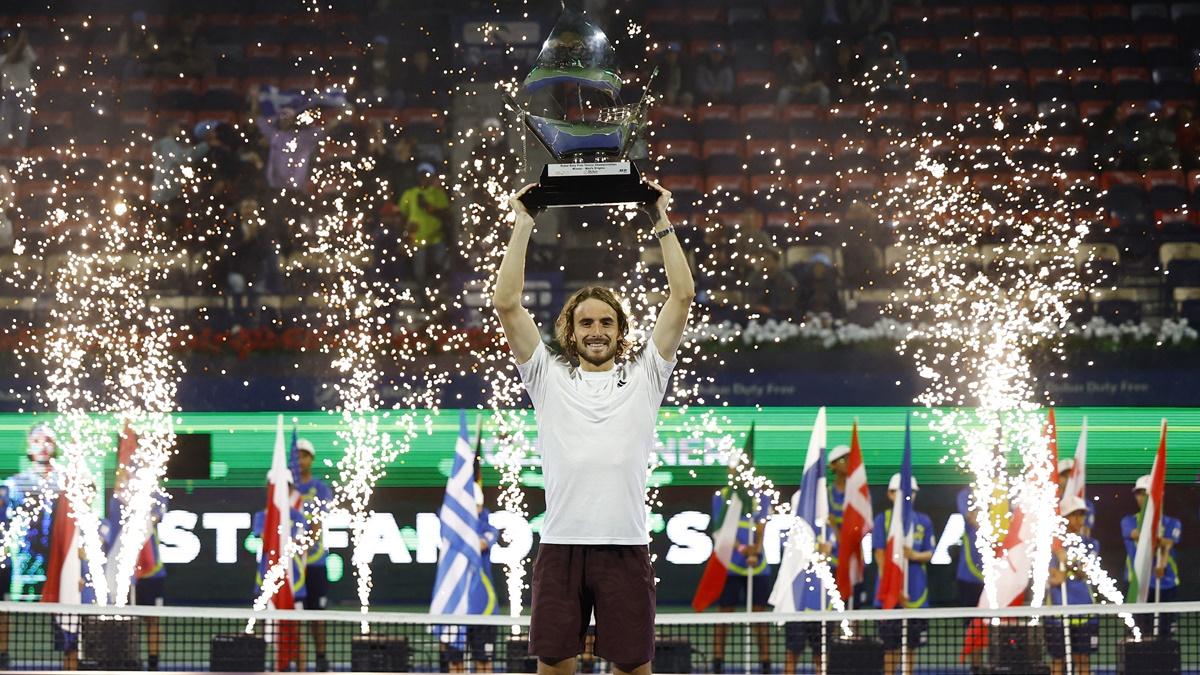 Greece's Stefanos Tsitsipas celebrates with trophy after beating Canada's Felix Auger Aliassime in the final of the Dubai Championships at Dubai Tennis Stadium, UAE. 