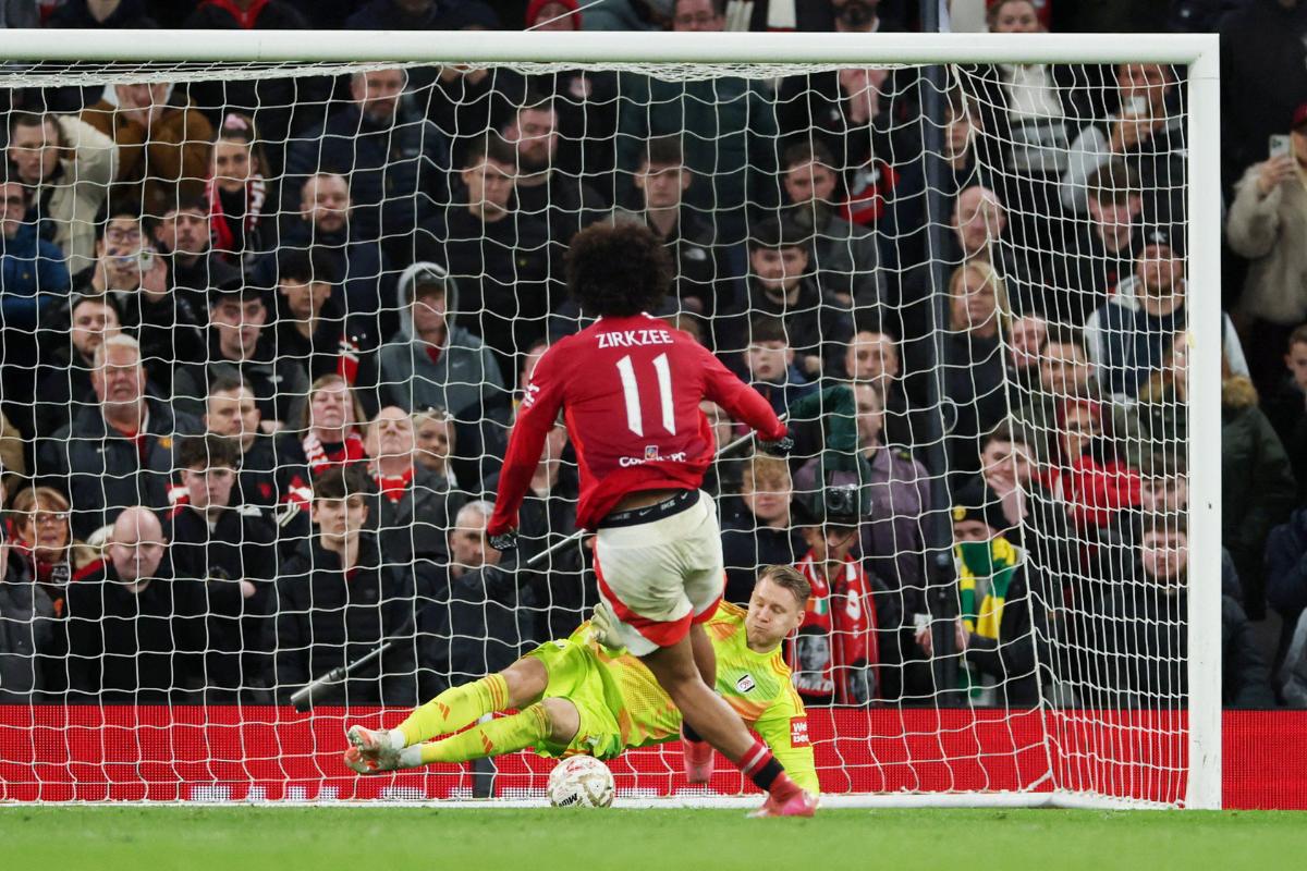 Fulham's Bernd Leno saves from Manchester United's Joshua Zirkzee to win the penalty shoot-out 