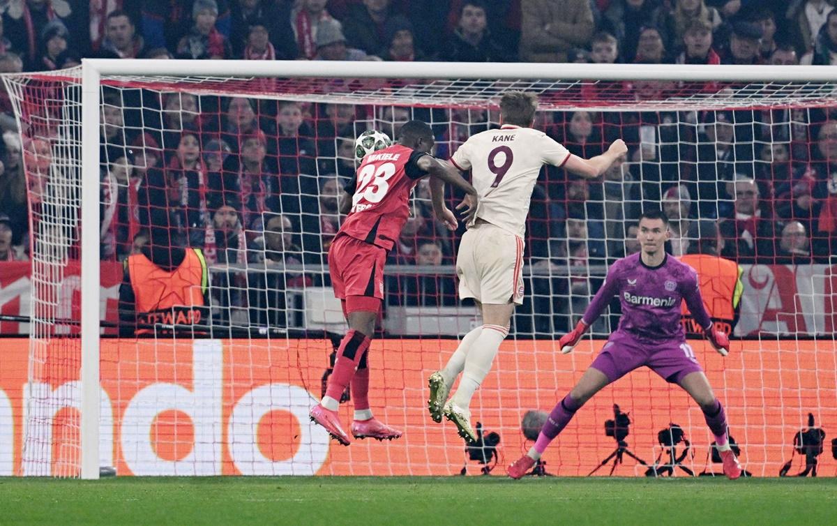 Harry Kane heads the ball past goalkeeper Matej Kovar for Bayern Munich's first goal in the Champions League Round of 16 first leg against Bayer Leverkusen at Allianz Arena, Munich.