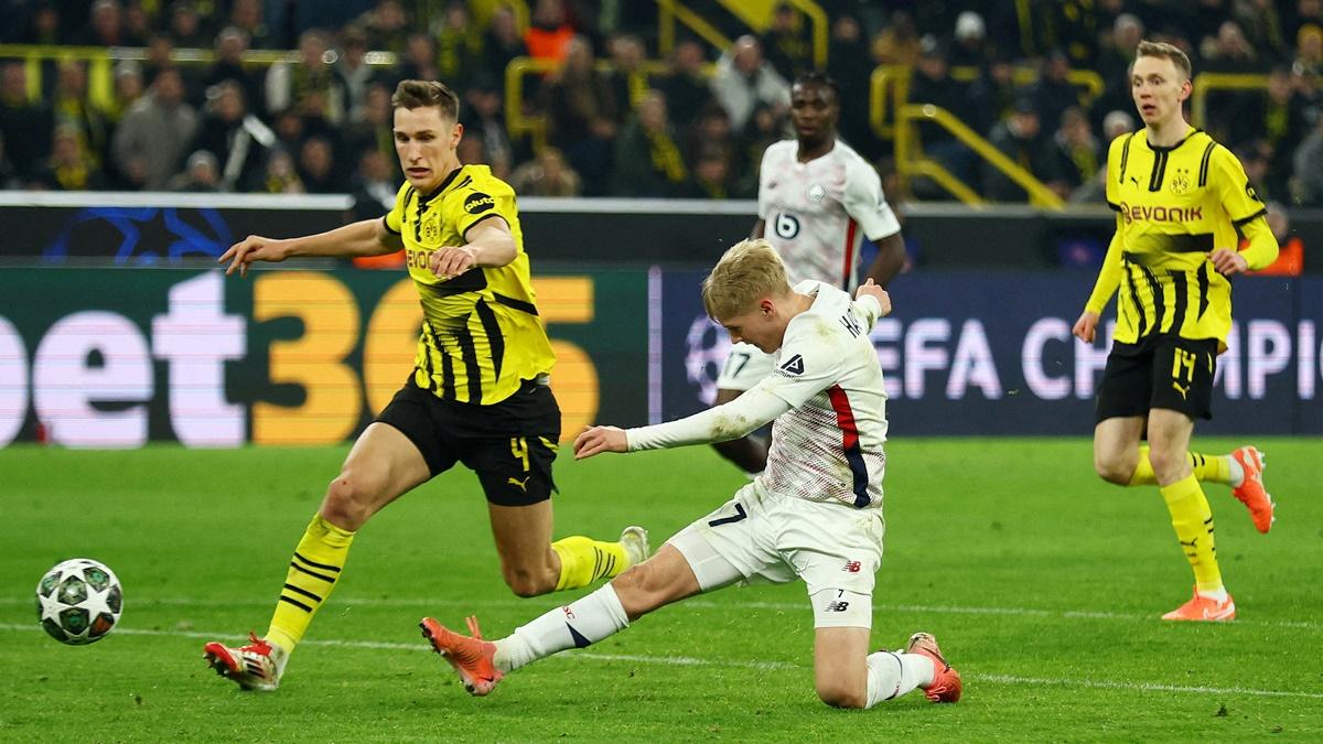 Hakon Arnar Haraldsson scores the equaliser for Lille during the Champions League Round of 16 first leg match against Borussia Dortmund at Signal Iduna Park, Dortmund, Germany.