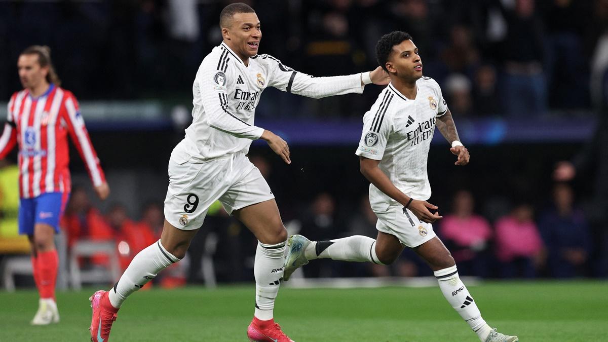 Rodrygo celebrates scoring Real Madrid's first goal with Kylian Mbappe during the Champions League Round of 16 first leg against Atletico Madrid in Santiago Bernabeu, Madrid.