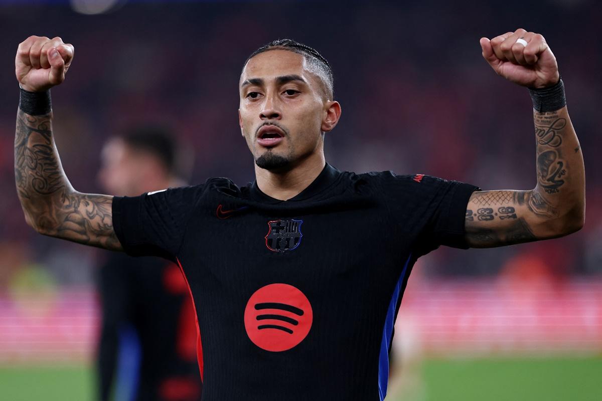 Raphinha celebrates scoring Barcelona's only goal of the match in the Champions League Round of 16 first leg against Benfica at Estadio da Luz, Lisbon, Portugal.