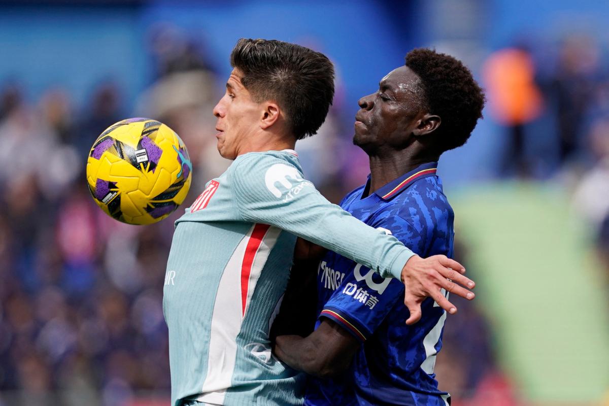 tletico Madrid's Giuliano Simeone in action with Getafe's Coba Da Costa