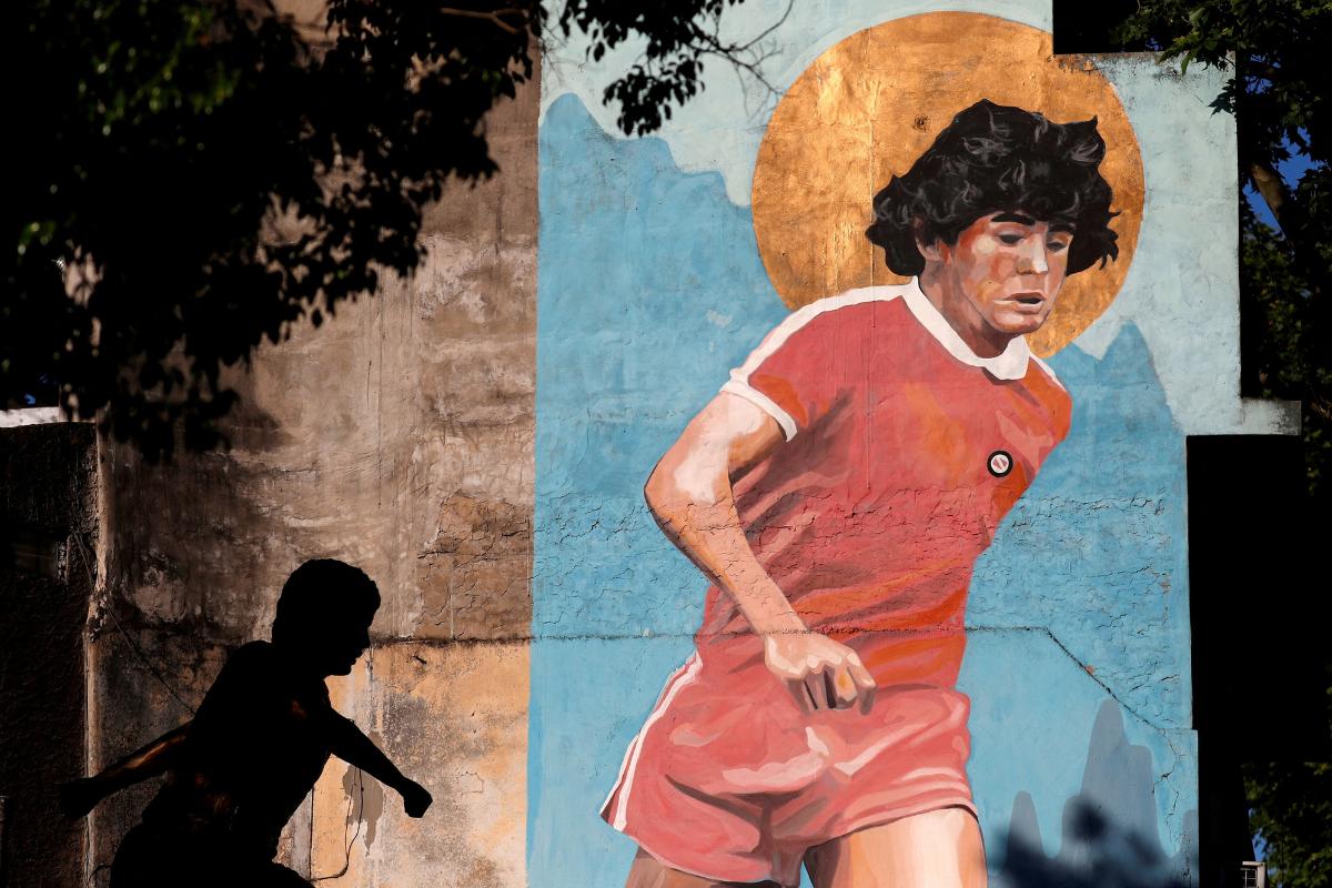 A mural depicting late soccer legend Diego Armando Maradona is pictured outside the Diego Maradona stadium, before a celebration marking his 61st birth date, in Buenos Aires, Argentina October 30, 2021