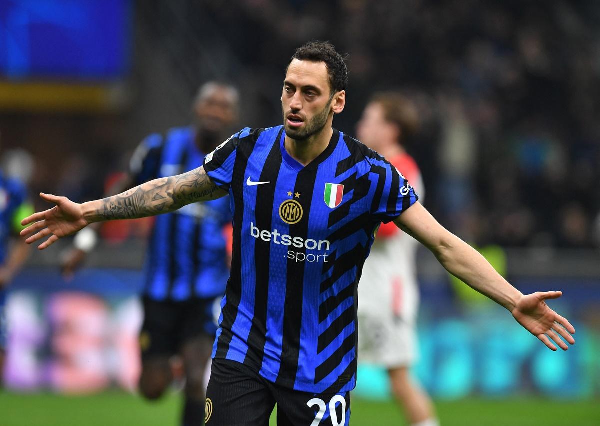 Hakan Calhanoglu celebrates scoring from the penalty spot for Inter Milan's second goal.