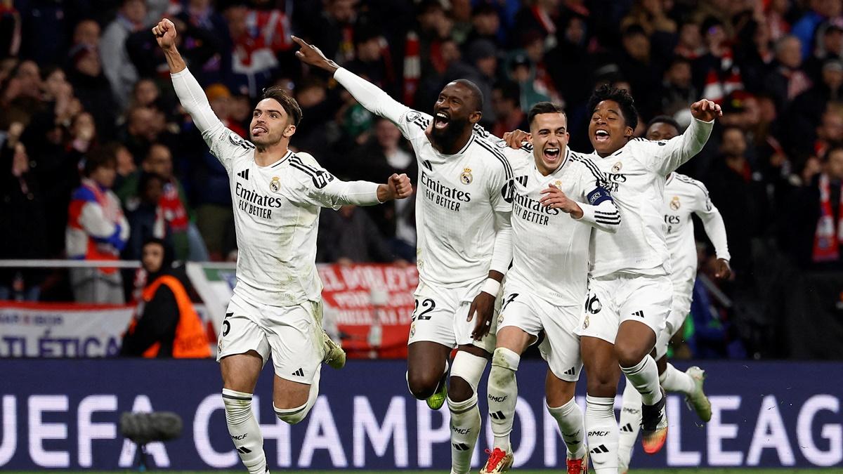 Antonio Rudiger celebrates with Lucas Vazquez and Endrick after scoring the decisive penalty for Real Madrid in the Champions League Round of 16 second leg match against Atletico Madrid at Metropolitano, Madrid, Spain, on Wednesday.