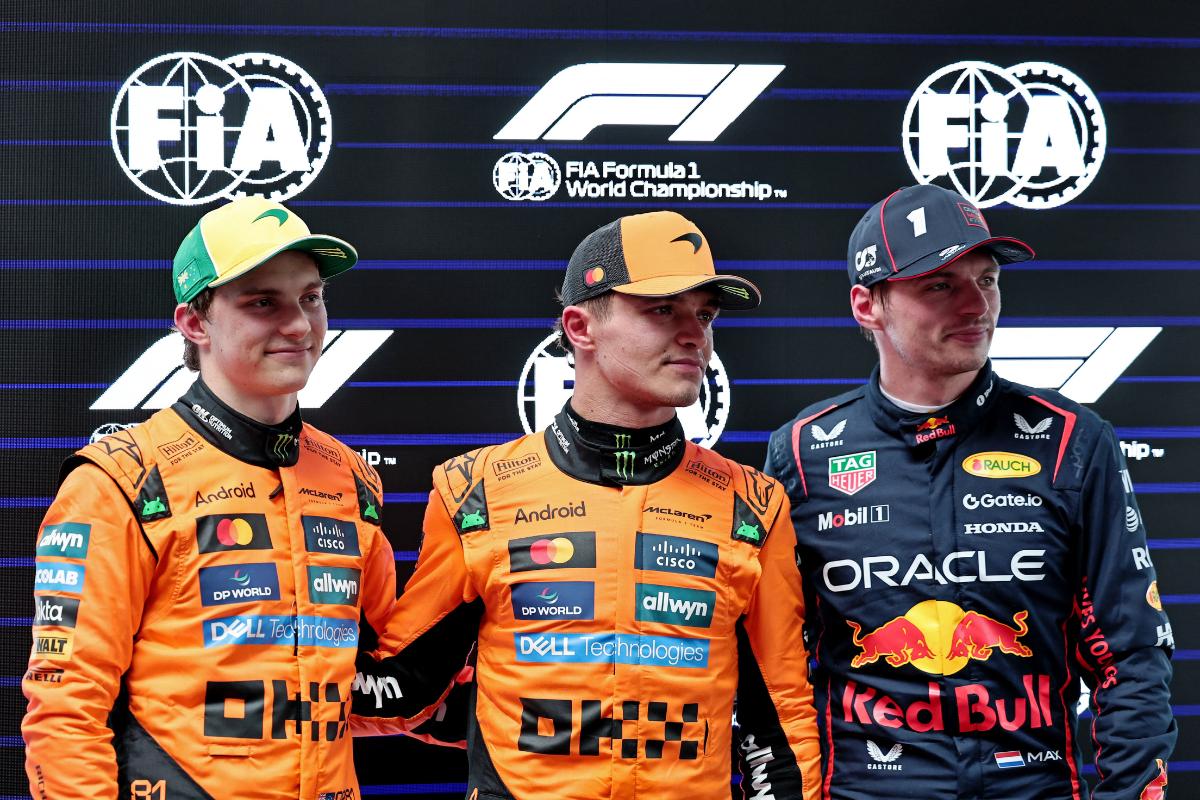 McLaren's Lando Norris celebrates after qualifying in pole position along with second placed McLaren's Oscar Piastri and third placed Red Bull's Max Verstappen 