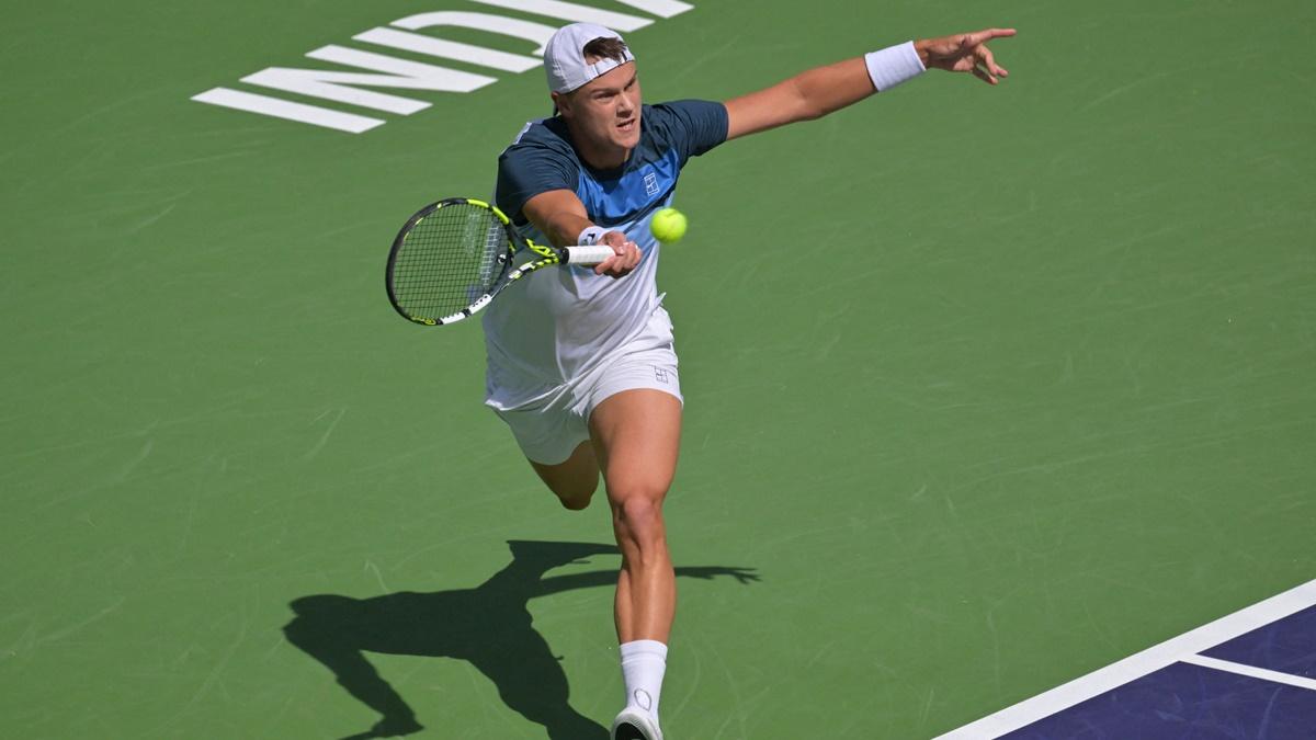 Denmark's Holger Rune makes a cross-court return during the BNP Paribas Open semi-final against Russia's Daniil Medvedev at the Indian Well Tennis Garden, CA, USA, on Saturday.