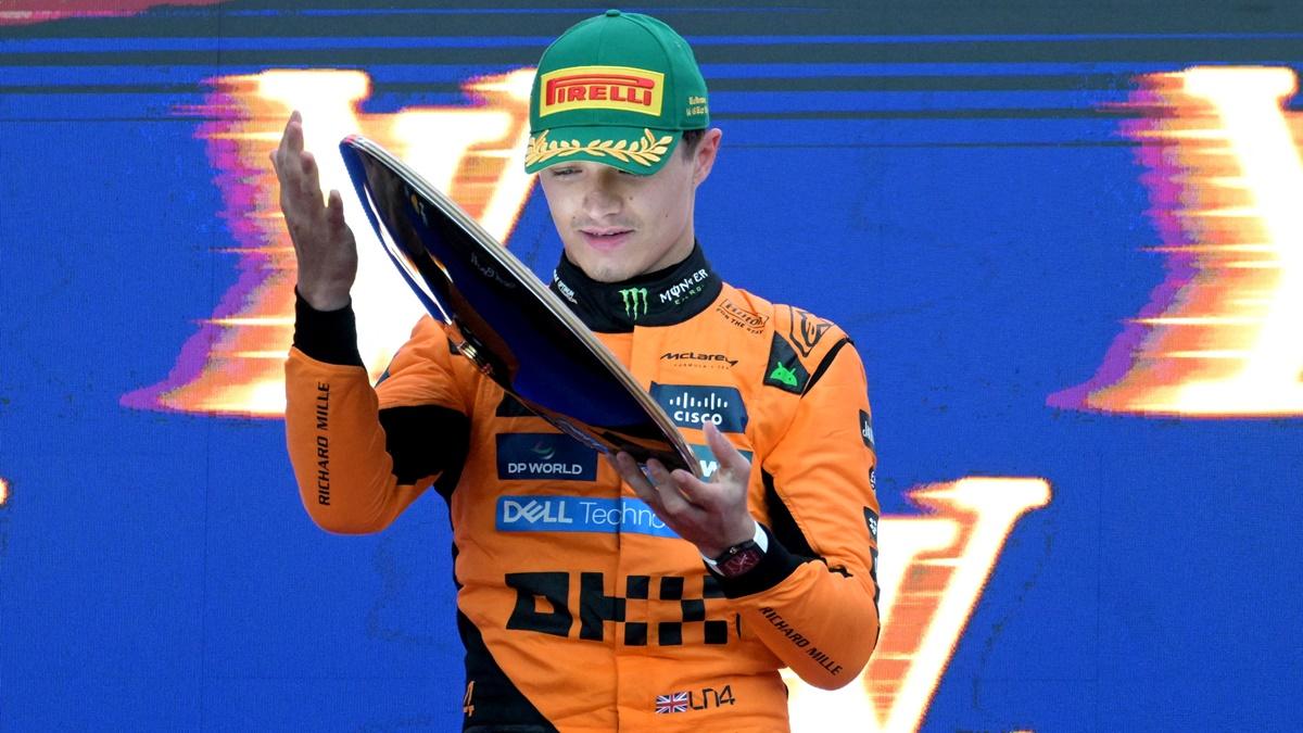 McLaren's Lando Norris celebrates with the trophy on the podium after winning the Australian Grand Prix at Albert Park Grand Prix Circuit, Melbourne, on Sunday.