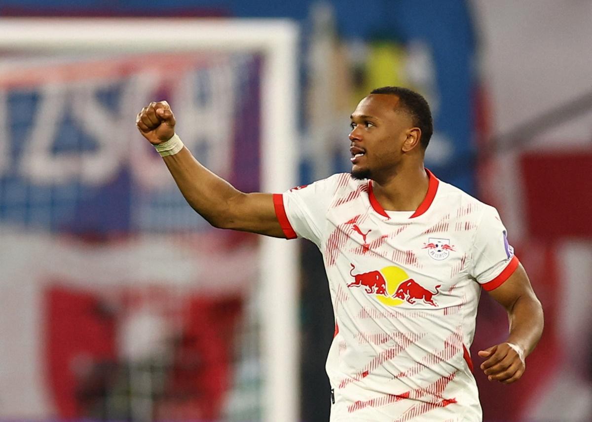 Lois Openda celebrates scoring RB Leipzig's second goal during the Bundesliga match against Borussia Dortmund at Red Bull Arena, Leipzig.