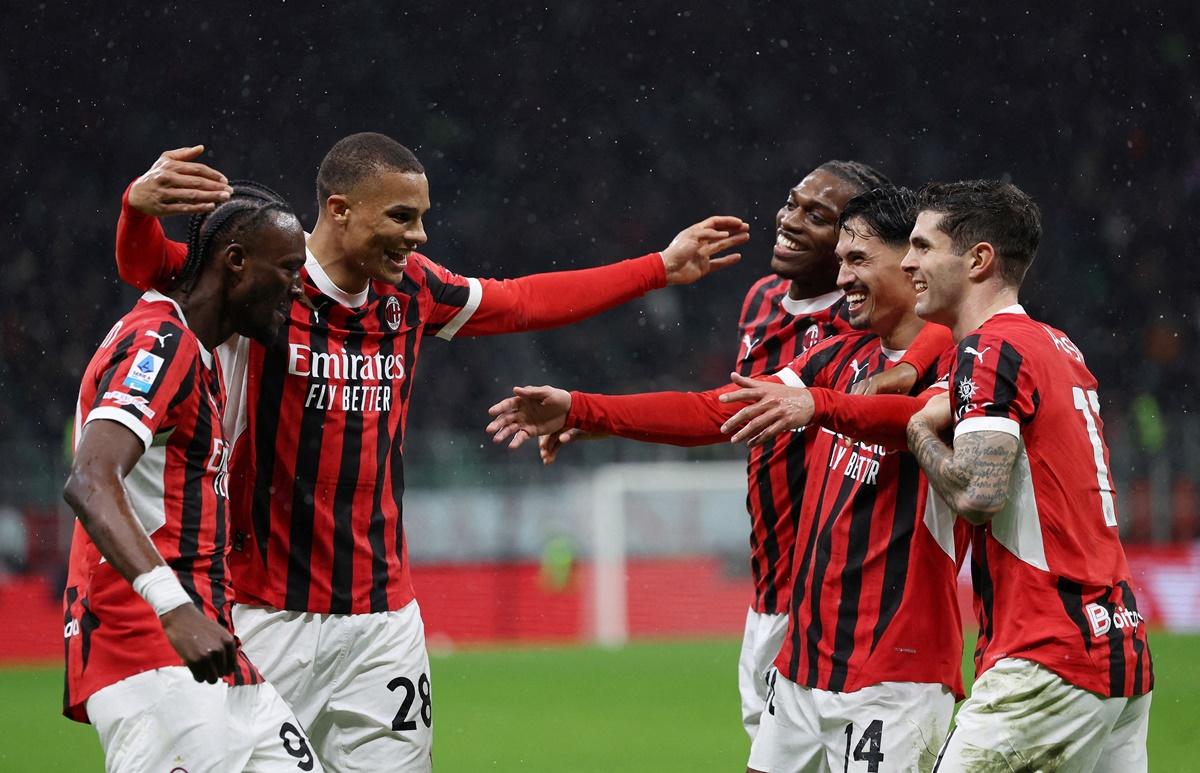 Tijjani Reijnders (No. 14) celebrates scoring AC Milan's second goal with teammates.