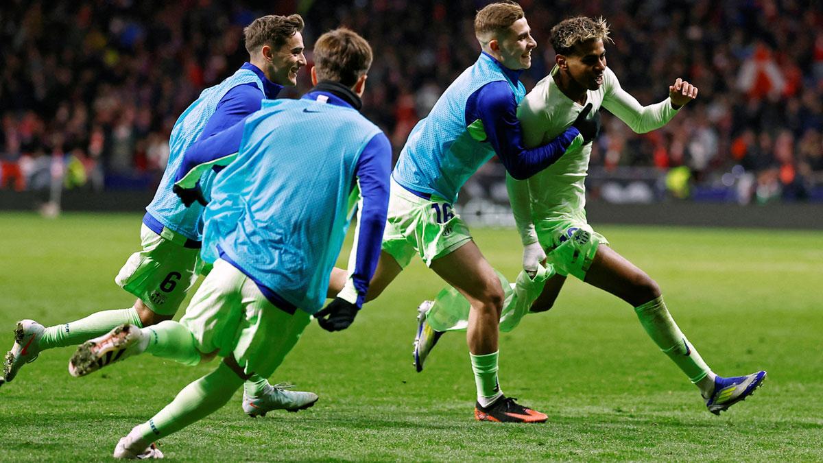 Lamine Yamal celebrates with teammates