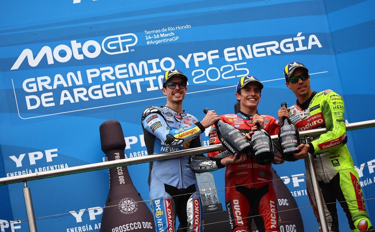 Marc Marquez, Alex Marquez and third placed Pertamina Enduro VR46 Racing Team's Franco Morbidelli celebrate with champagne on the podium.