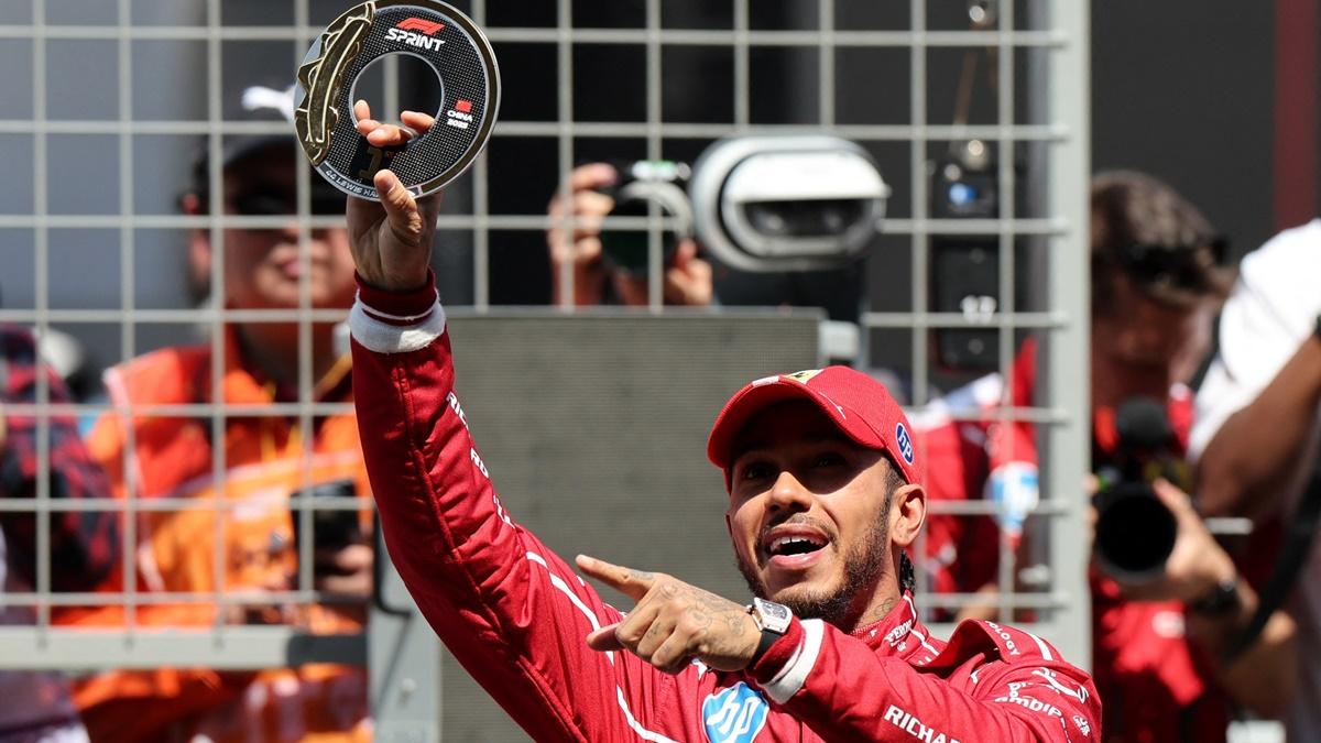 Ferrari's Lewis Hamilton celebrates after winning the sprint in the Chinese Formula One Grand Prix at Shanghai International Circuit, Shanghai, on Friday.