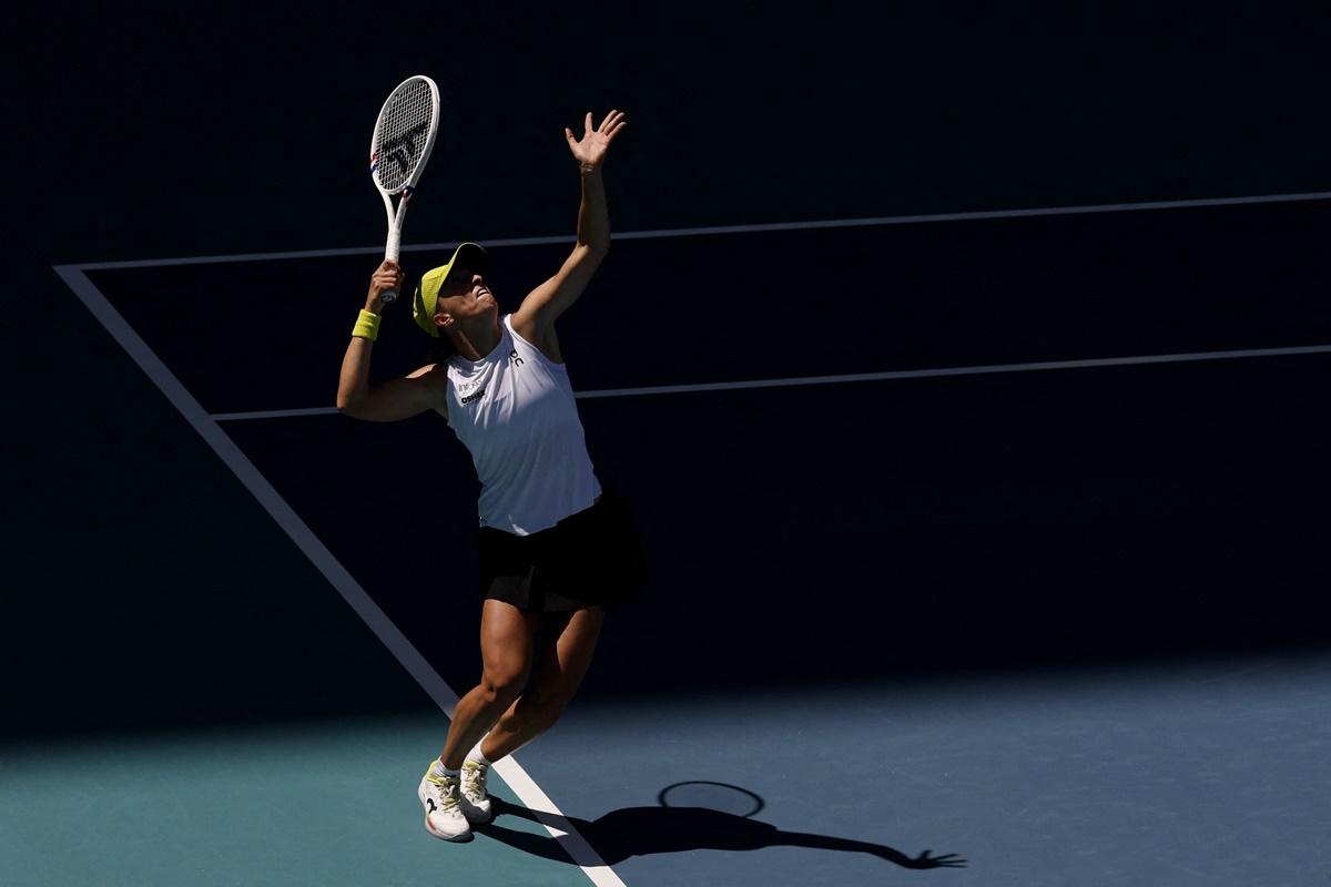 Poland's Iga Swiatek serves against France's Caroline Garcia.