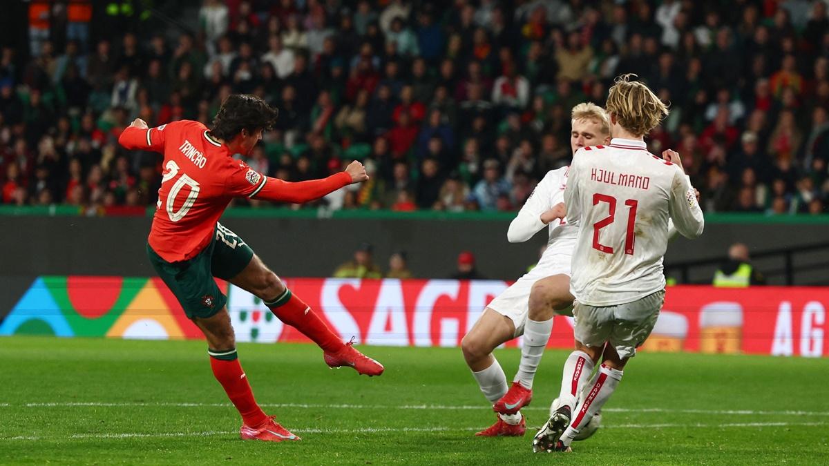 Francisco Trincao scores Portugal's third goal.