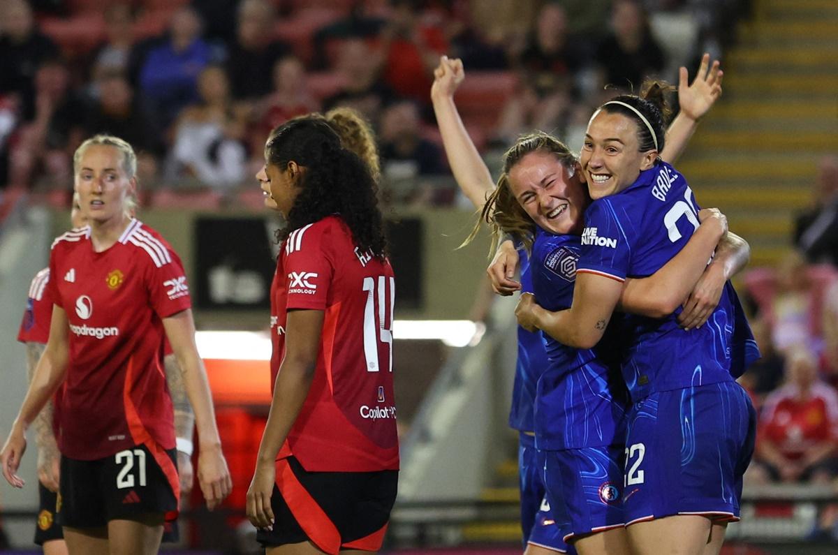 Chelsea's Lucy Bronze celebrates with Wieke Kaptein after scoring the only goal of the match.