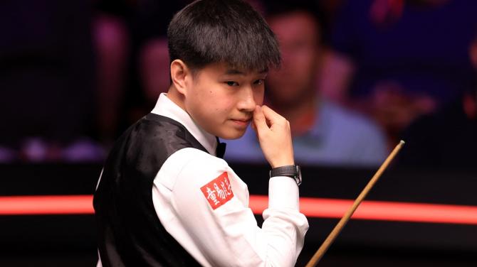 China's Zhao Xintong during the World Snooker Championship semi-final against England's Ronnie O'Sullivan at the Crucible Theatre, Sheffield, Britain, on Friday.