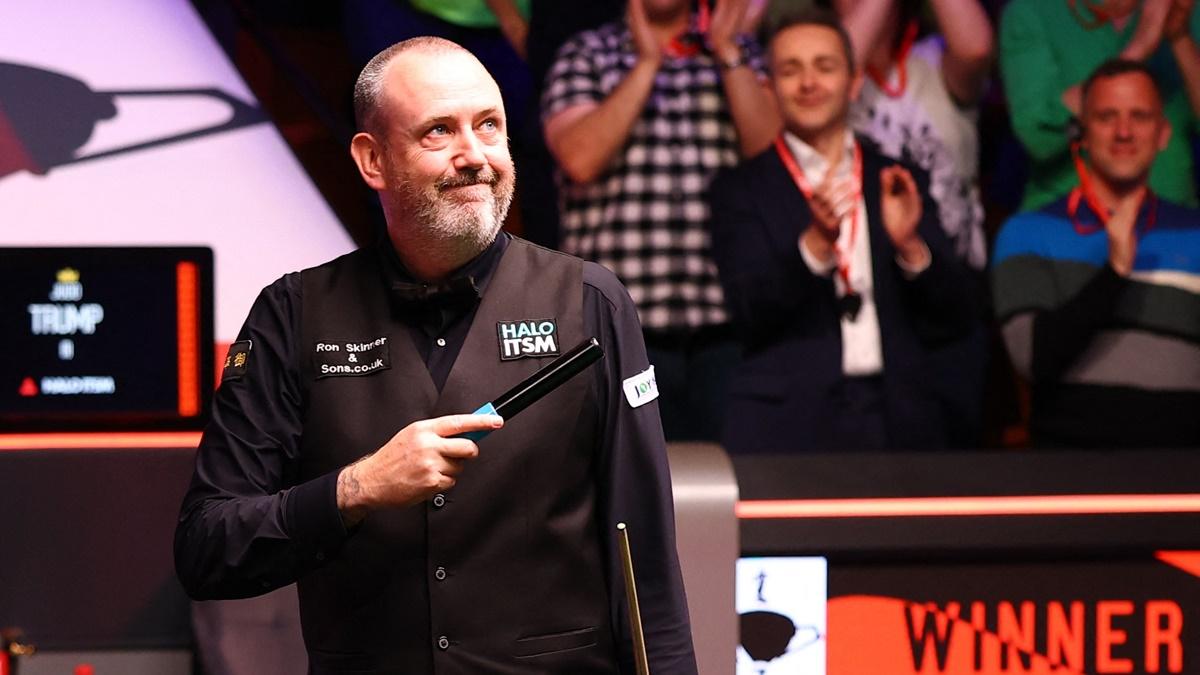 Wales's Mark Williams celebrates victory over England's Judd Trump in the semi-finals of the World Snooker Championship, at The Crucible Theatre, Sheffield, Britain, on Saturday.