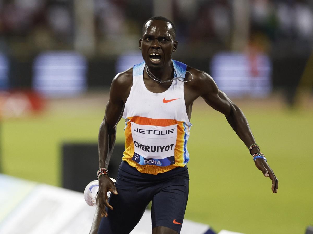 Kenya's Reynold Cheruiyot reacts as he crosses the line to win the men's 5000 metres.