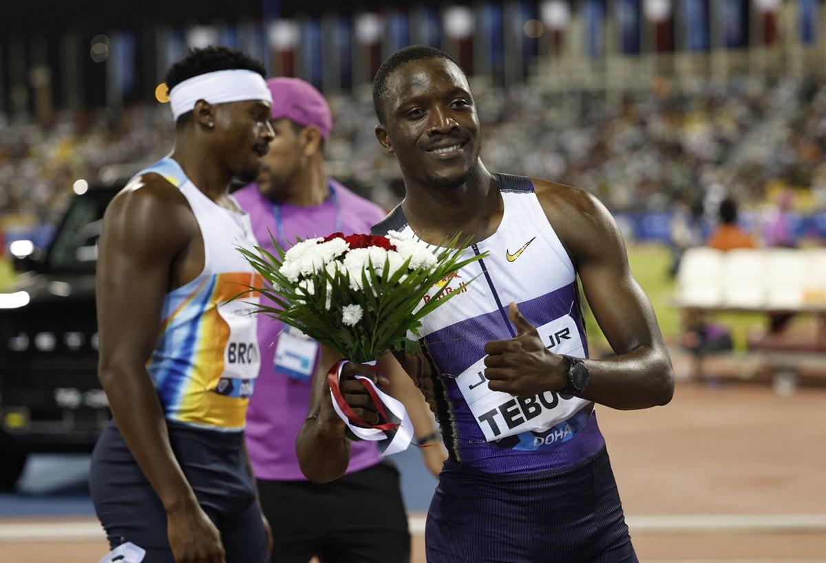 Letsile Tebogo celebrates winning the men's 200 metres.
