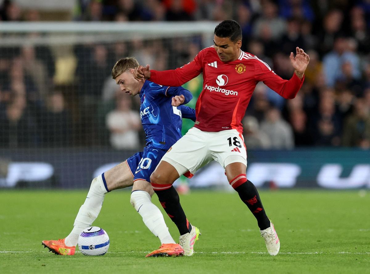 Chelsea's Cole Palmer and Manchester United's Casemiro battle for possession.