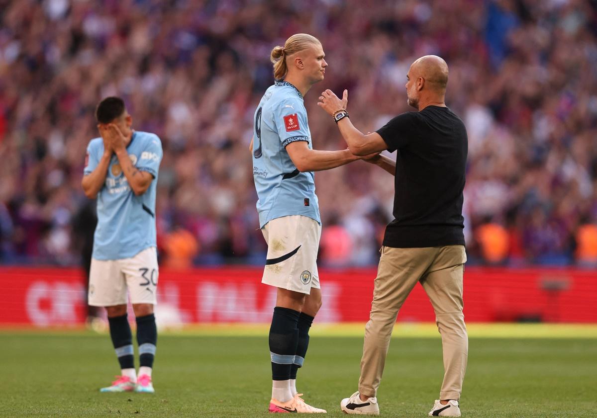 Manchester City's Erling Haaland and manager Pep Guardiola after the stunning defeat to Crystal Palace.