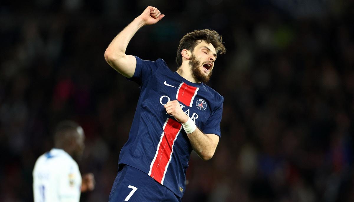 Khvicha Kvaratskhelia celebrates scoring Paris St Germain's third goal against Auxerre.