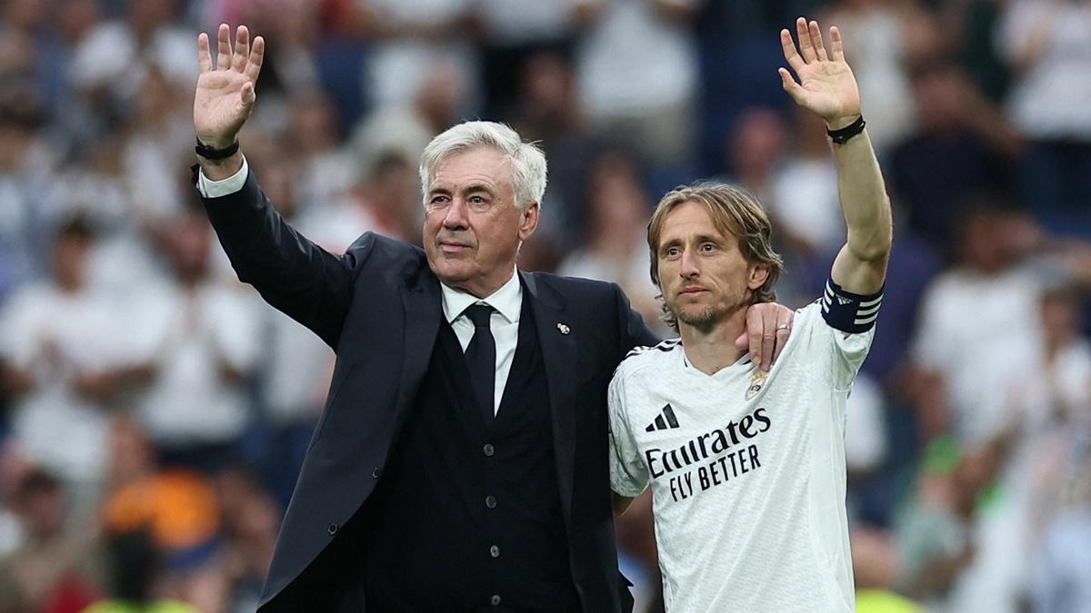Real Madrid coach Carlo Ancelotti and midfielder Luka Modric acknowledge fans on the pitch after their last LaLiga match for the club, against Real Sociedad, at Santiago Bernabeu, Madrid, Spain, on Saturday.