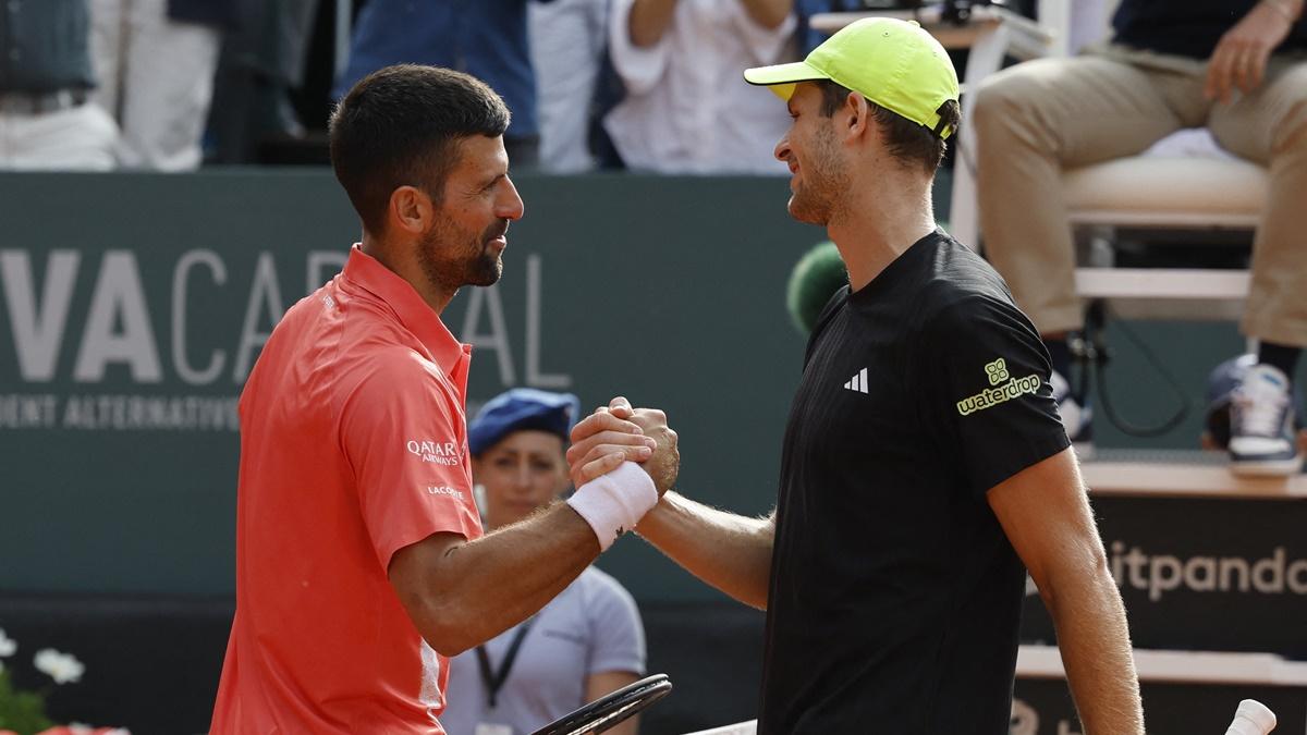 Novak Djokovic shakes hands with Hubert Hurkacz after the final.