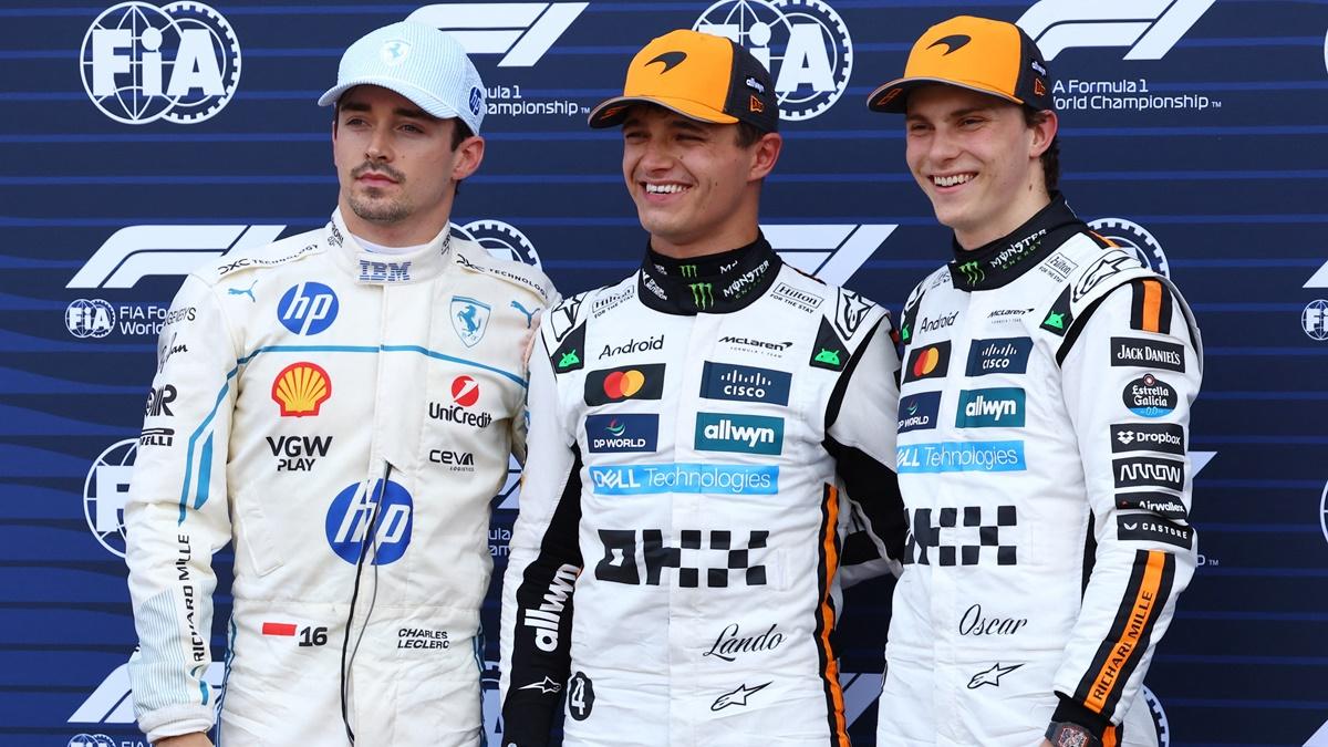 McLaren's Lando Norris celebrates after qualifying in pole position with second placed Ferrari's Charles Leclerc and third placed McLaren's Oscar Piastri at the Formula One Monaco Grand Prix, at Circuit de Monaco, on Saturday.