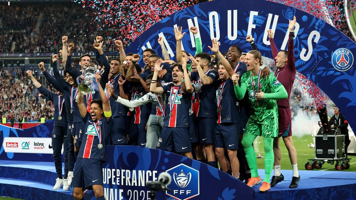 Paris St Germain players celebrate with the trophy after defeating Stade de Reims in the final of the Coupe de France, at Stade de France, Saint-Denis, France, on Saturday.