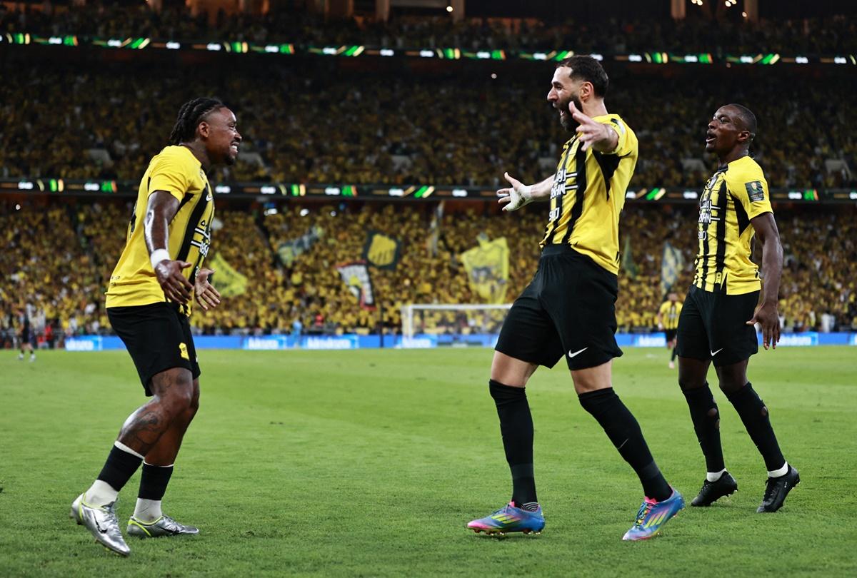 Karim Benzema celebrates scoring Al Ittihad's first goal with Steven Bergwijn.