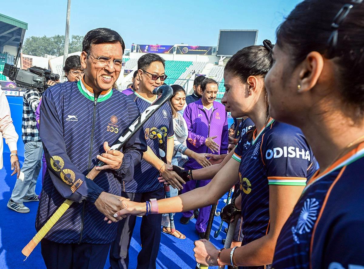 Union Minister Mansukh Mandaviya with Union Minister of Parliamentary Affairs Kiren Rijiju exchange handshakes with players ahead of the exhibition match 