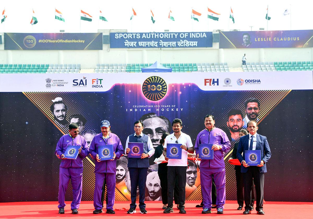 Union Minister  Mansukh Mandaviya with Tamil Nadu Deputy Chief Minister Udhayanidhi Stalin and others during an event marking 100 years of Indian hockey at Major Dhyan Chand National Stadium, in New Delhi on Friday