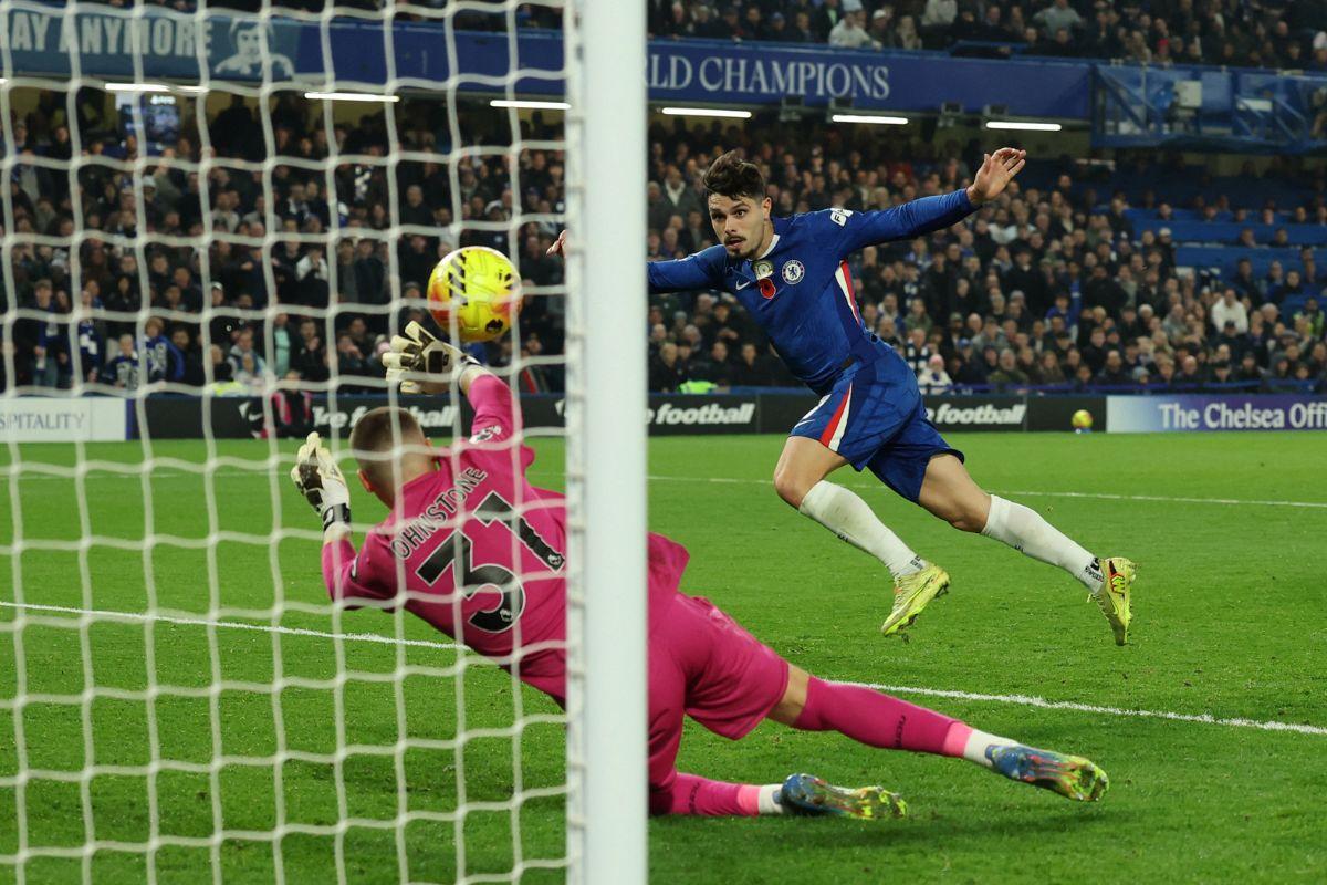Chelsea's Pedro Neto scores their third goal against Wolverhampton Wanderers at Stamford Bridge, London