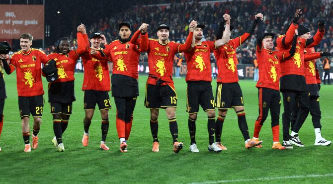 Belgium's players celebrate after winning their group Belgium's players celebrate after winning their group