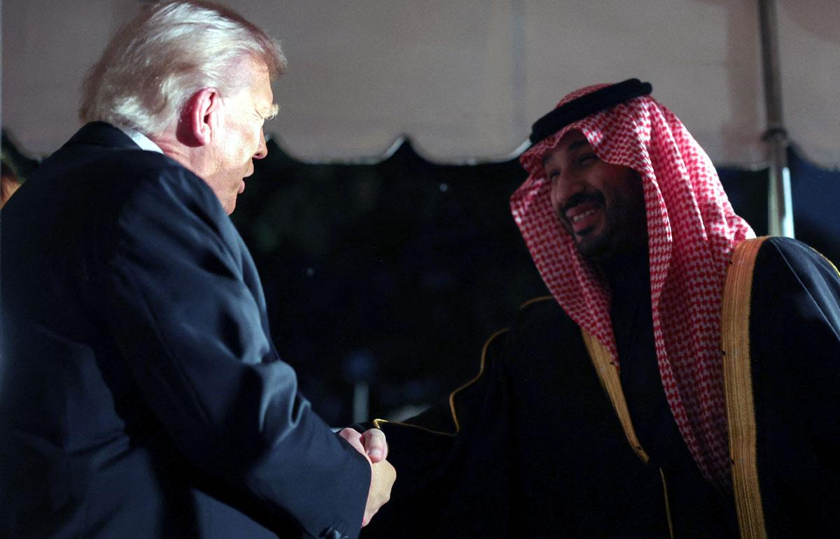 Saudi Crown Prince and Prime Minister Mohammed bin Salman shakes hands with US President Donald Trump