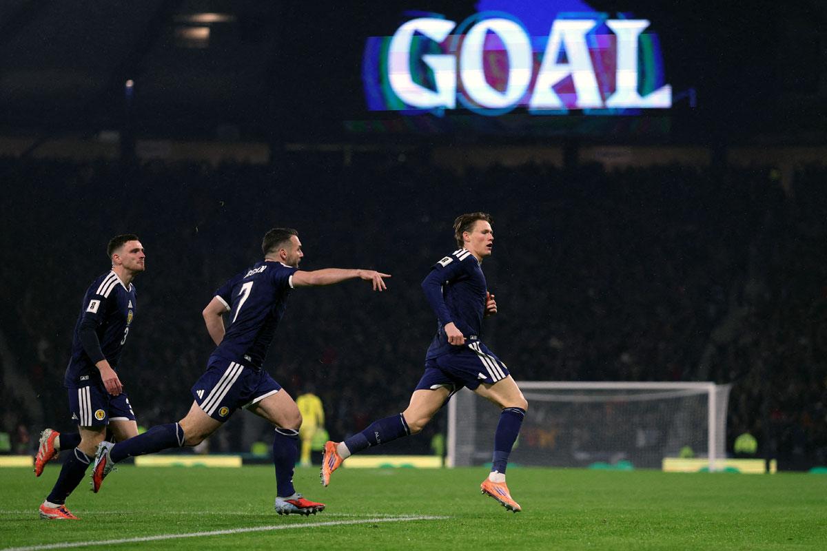 Scott McTominay celebrates scoring Scotland's first goal Scott McTominay celebrates scoring Scotland's first goal